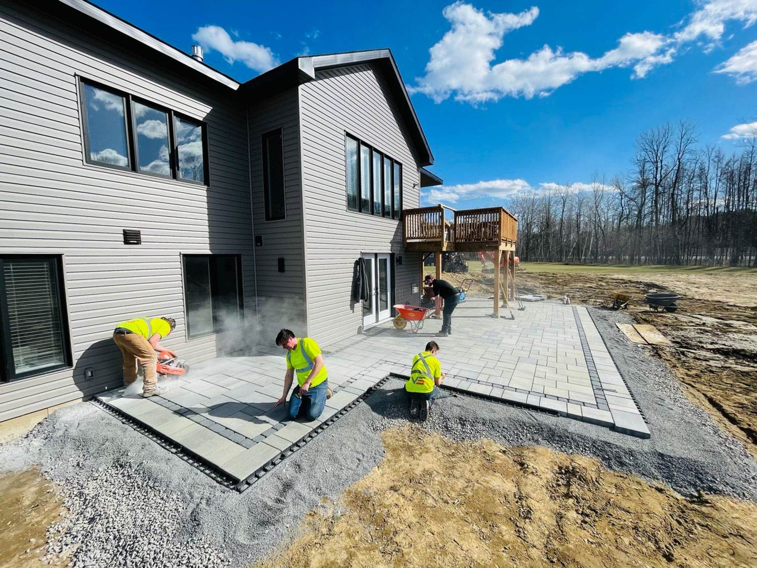 A VS Landscape crew laying a patio